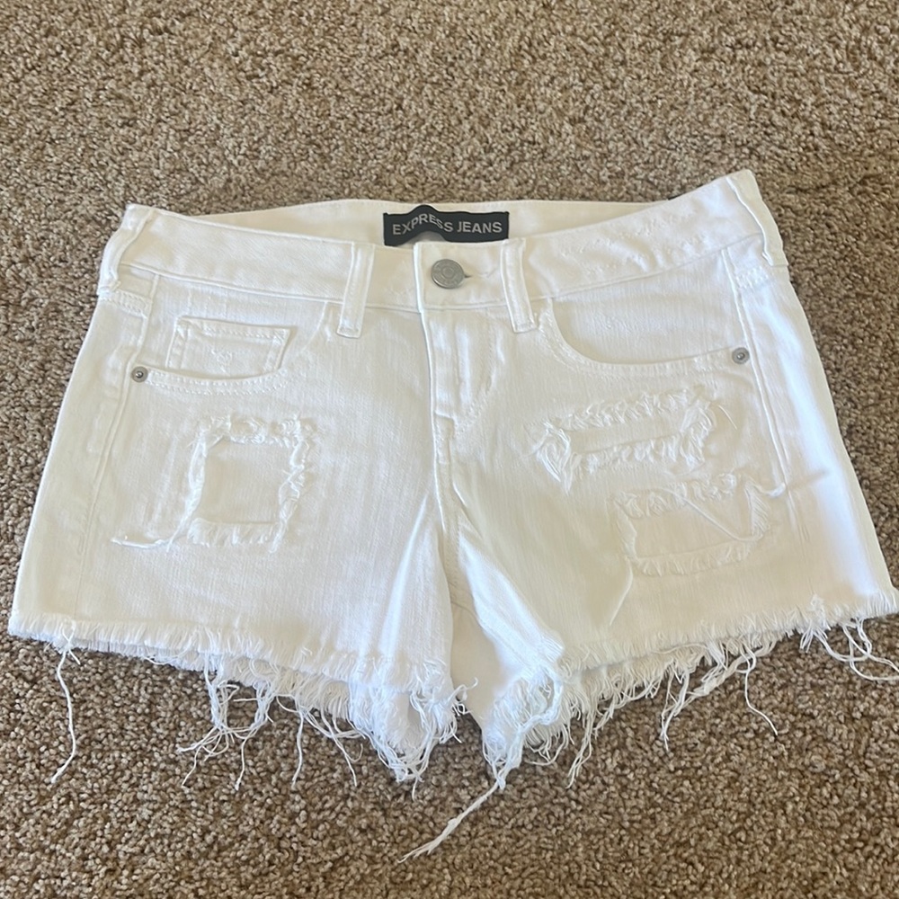 Express low rise white denim shorts.